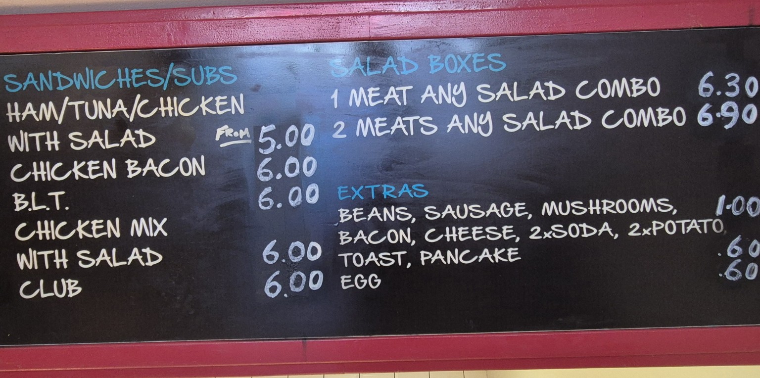 Basil's sandwich and salad menu board
